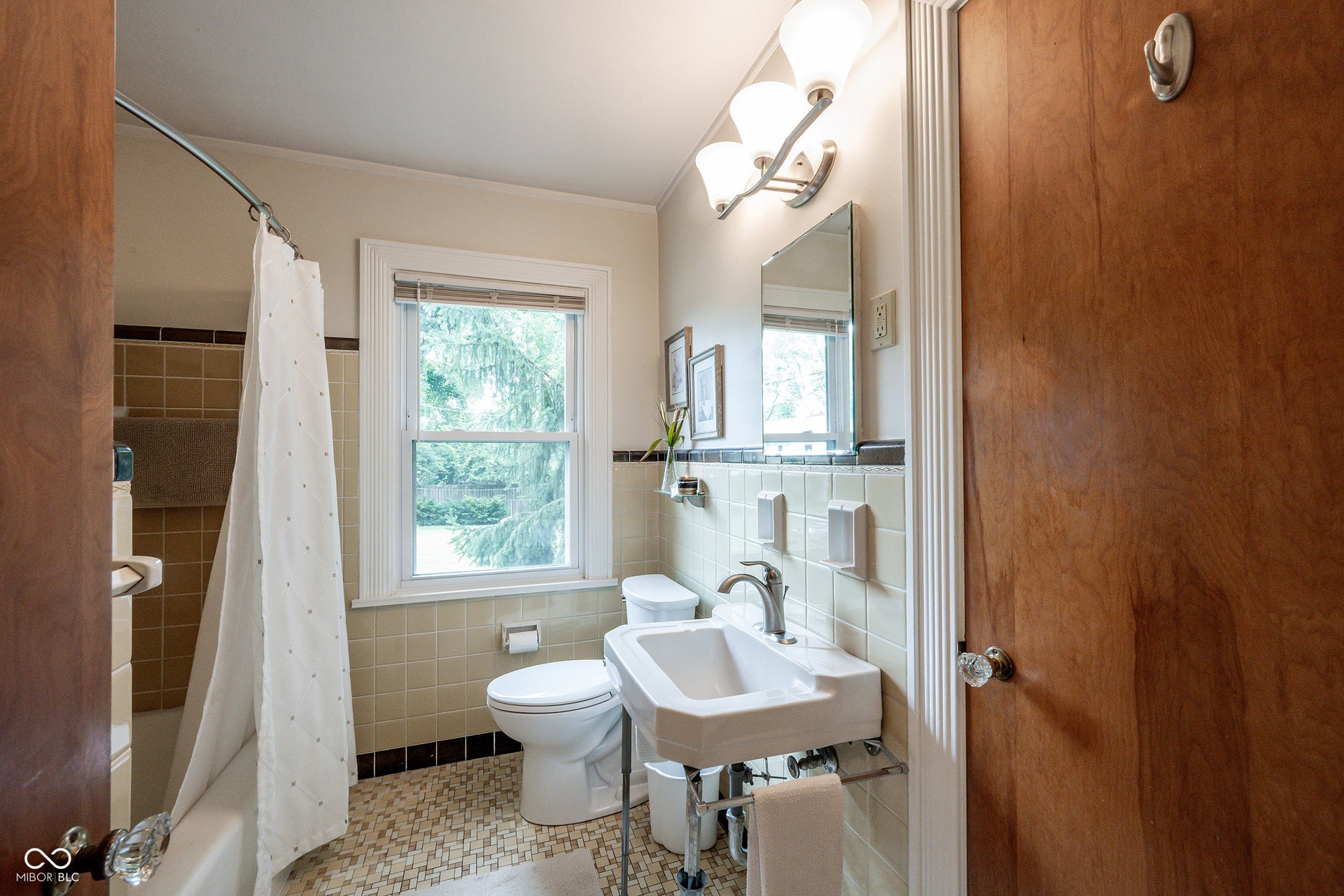 Full Second Bath with Crown Moldding has the original beautiful finishes in