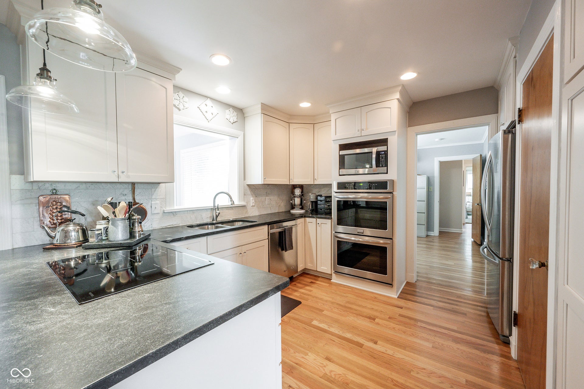 Ceiling Height Cabinetry with Crown Mold, Built In Double Convection Ovens, Custom Marble Backsplash, Honed Granite Countertops, Custom Pantry Cabinet...a Chef's Dream Kitchen