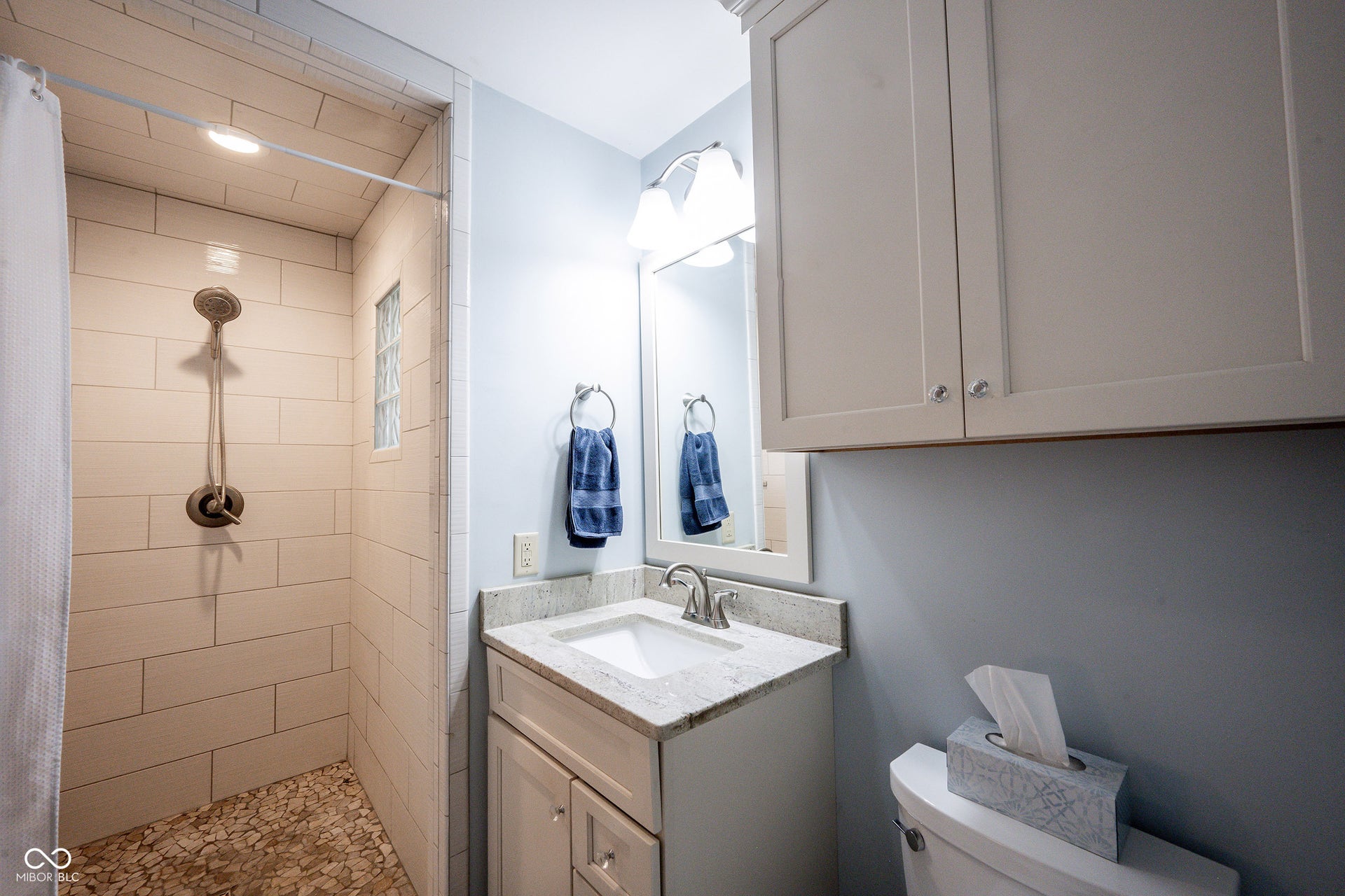 Custom Remodeled Full Bath with tiled shower and walk in Closet