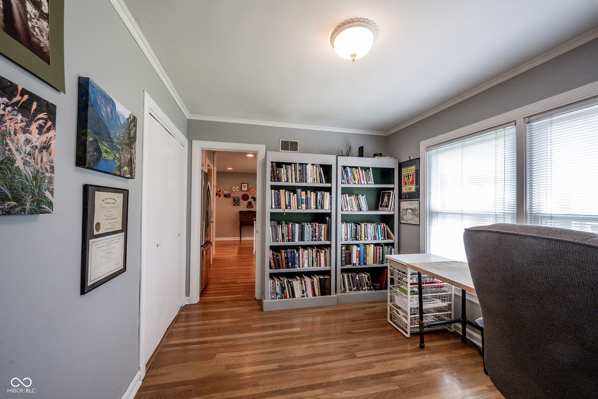 Bedroom 3 w/3/4" Hardwood and Crown Moldding, located between the Kitchen and Back Hallway, is currently being used as an Office but with a closet, many possibilities await the next owner
