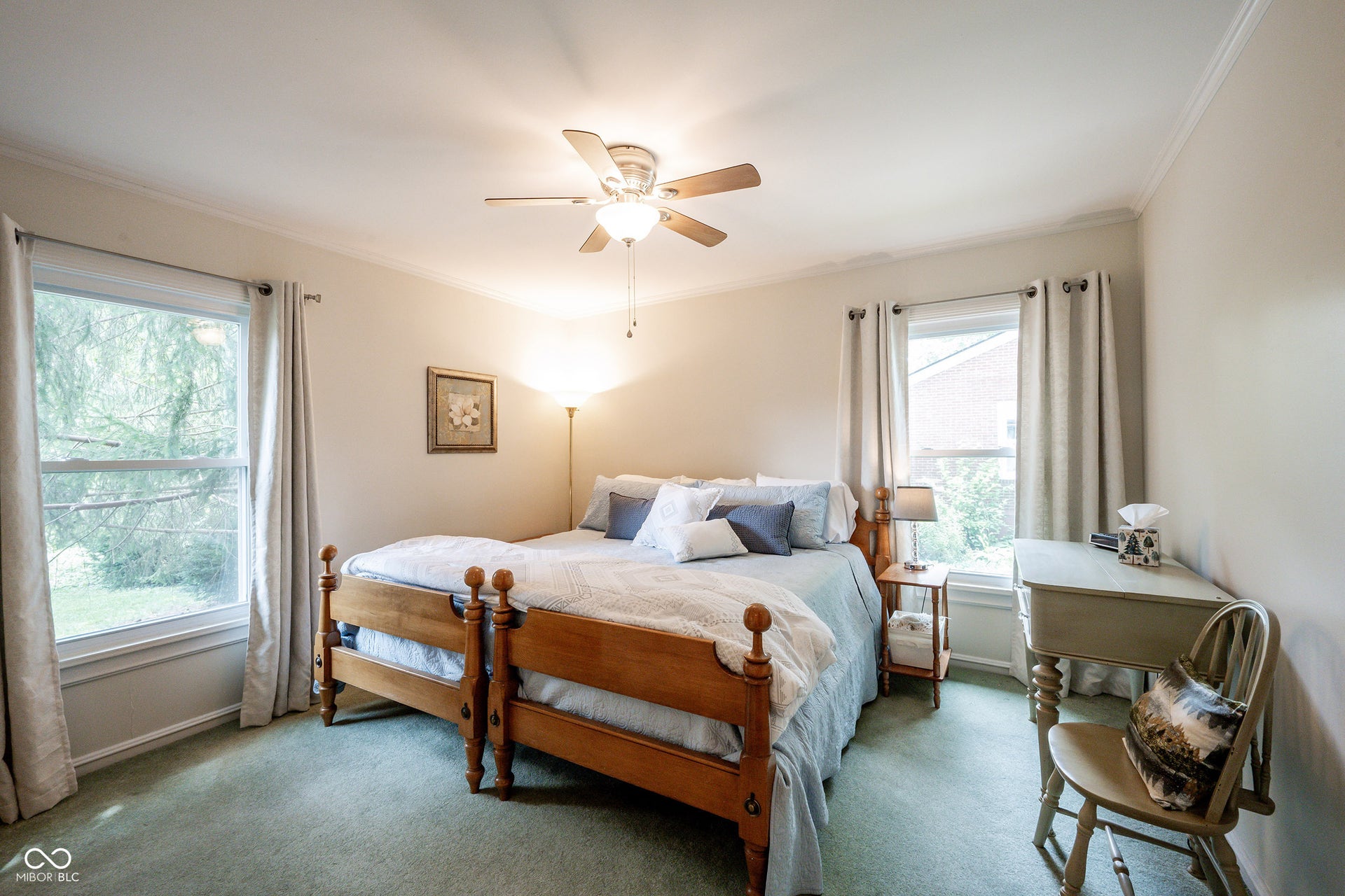 Bedroom 2 with Carpet, Crown Molding and Ceiling Fan/Light...3/4" Hardwood Flooring is underneath the Carpet