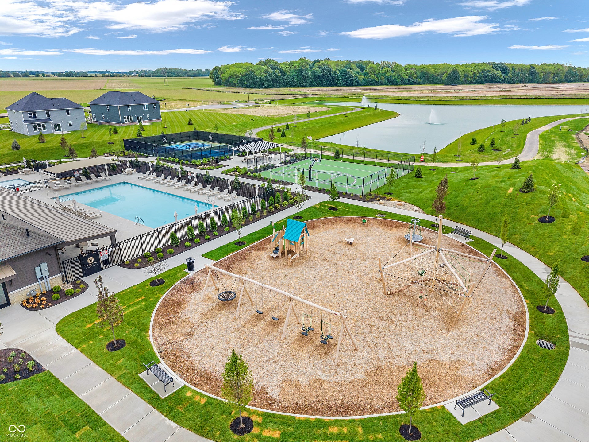Community amenities featuring a swimming pool, tennis courts, recreational playground, and a pond with a fountain