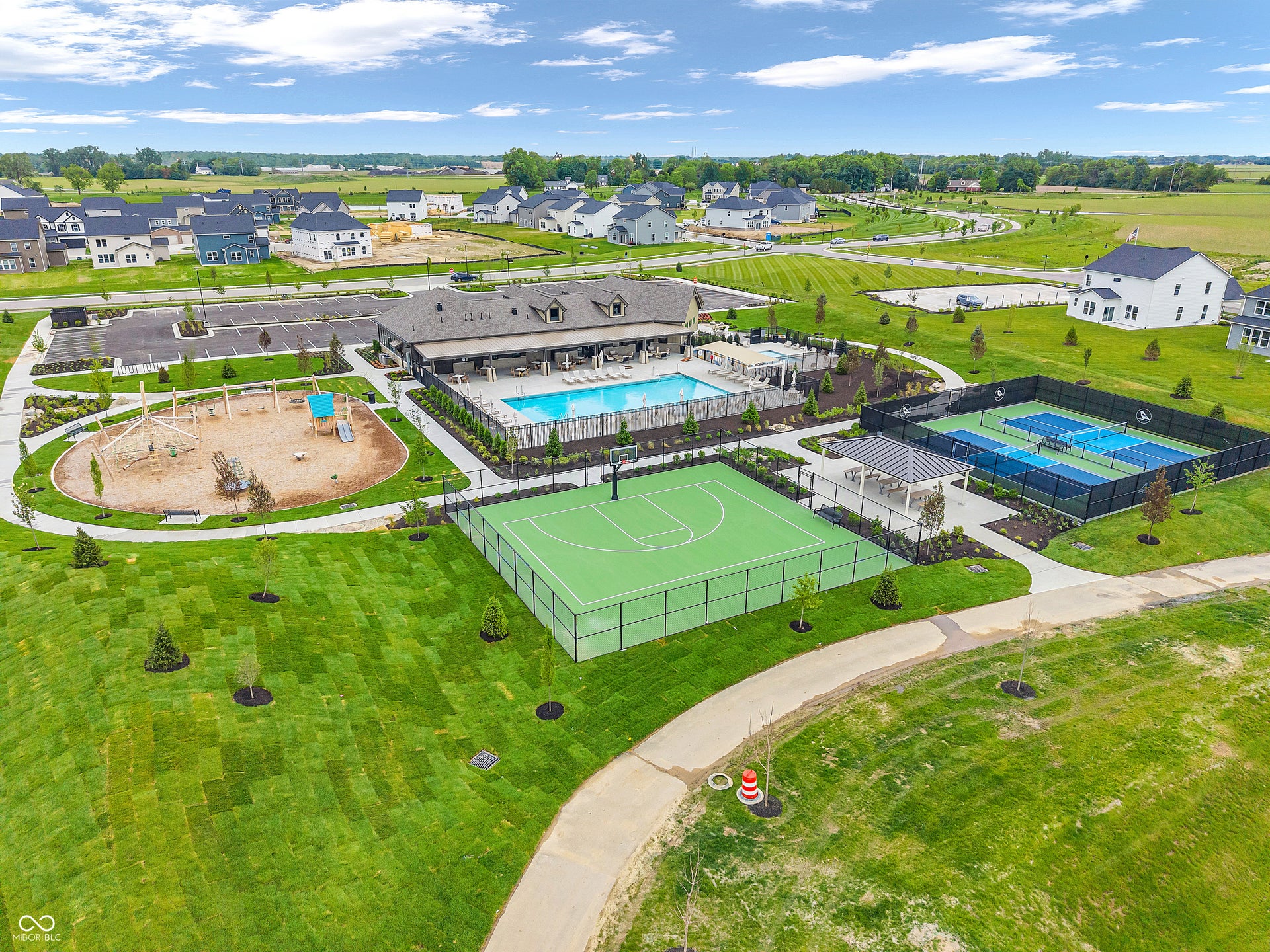 Community amenities featuring a swimming pool, basketball court, tennis courts, and playground area