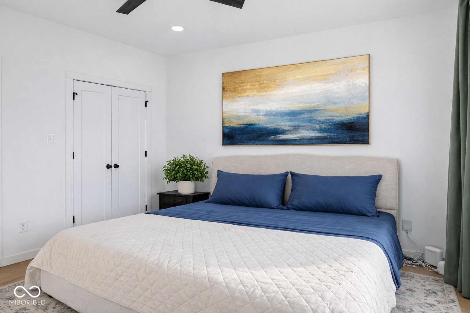 Bedroom space featuring a white color palette, recessed lighting, and a ceiling fan