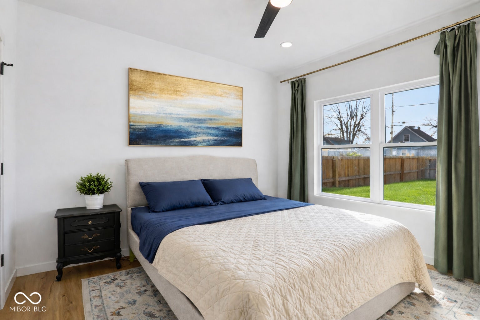 Bright interior with wood-finish flooring and white walls