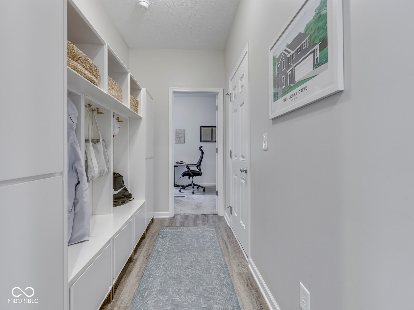 Mud room from garage entry with built-in organizer