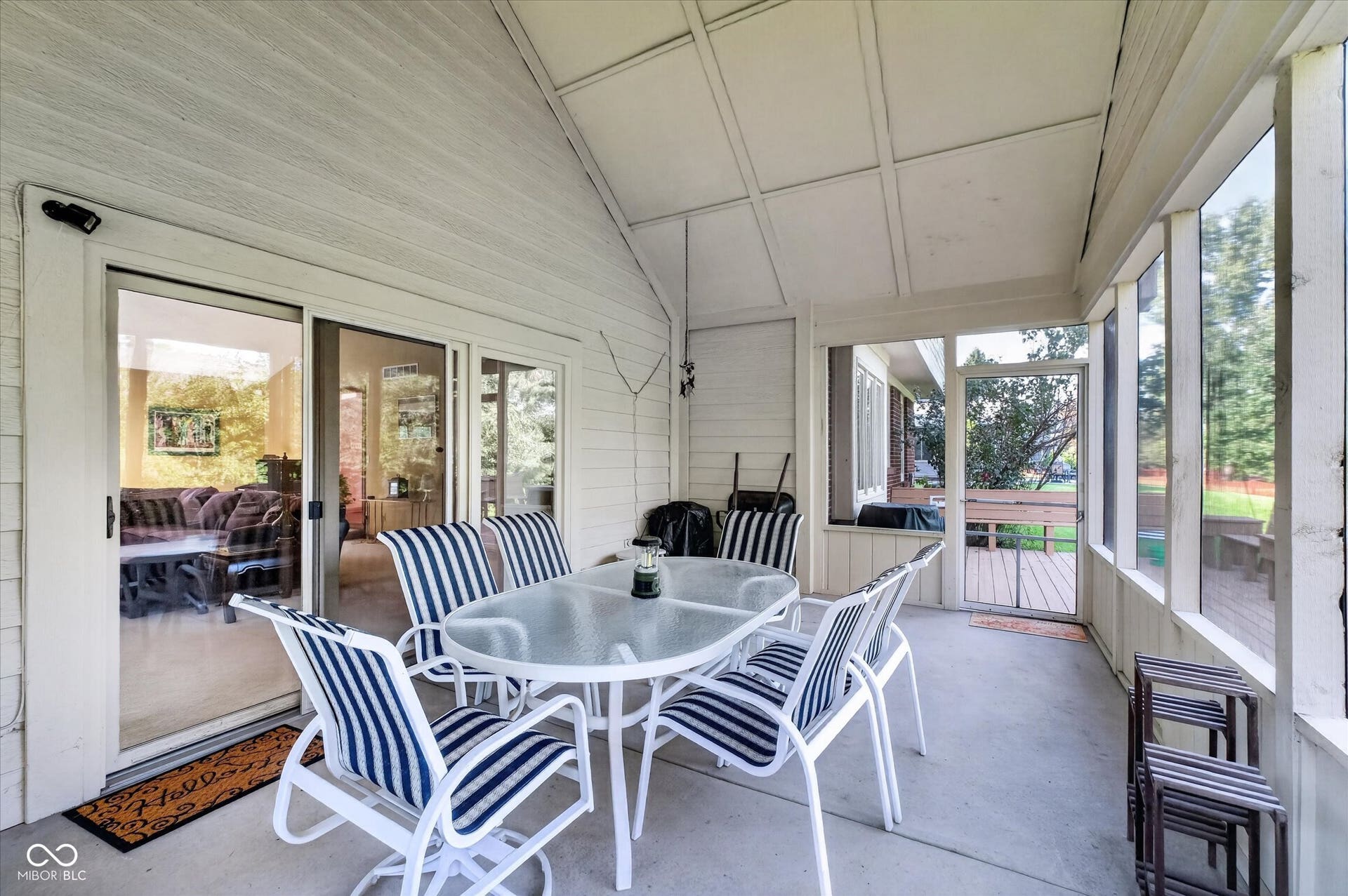 Screened-in porch with outdoor ceiling fan for enjoying summer nights