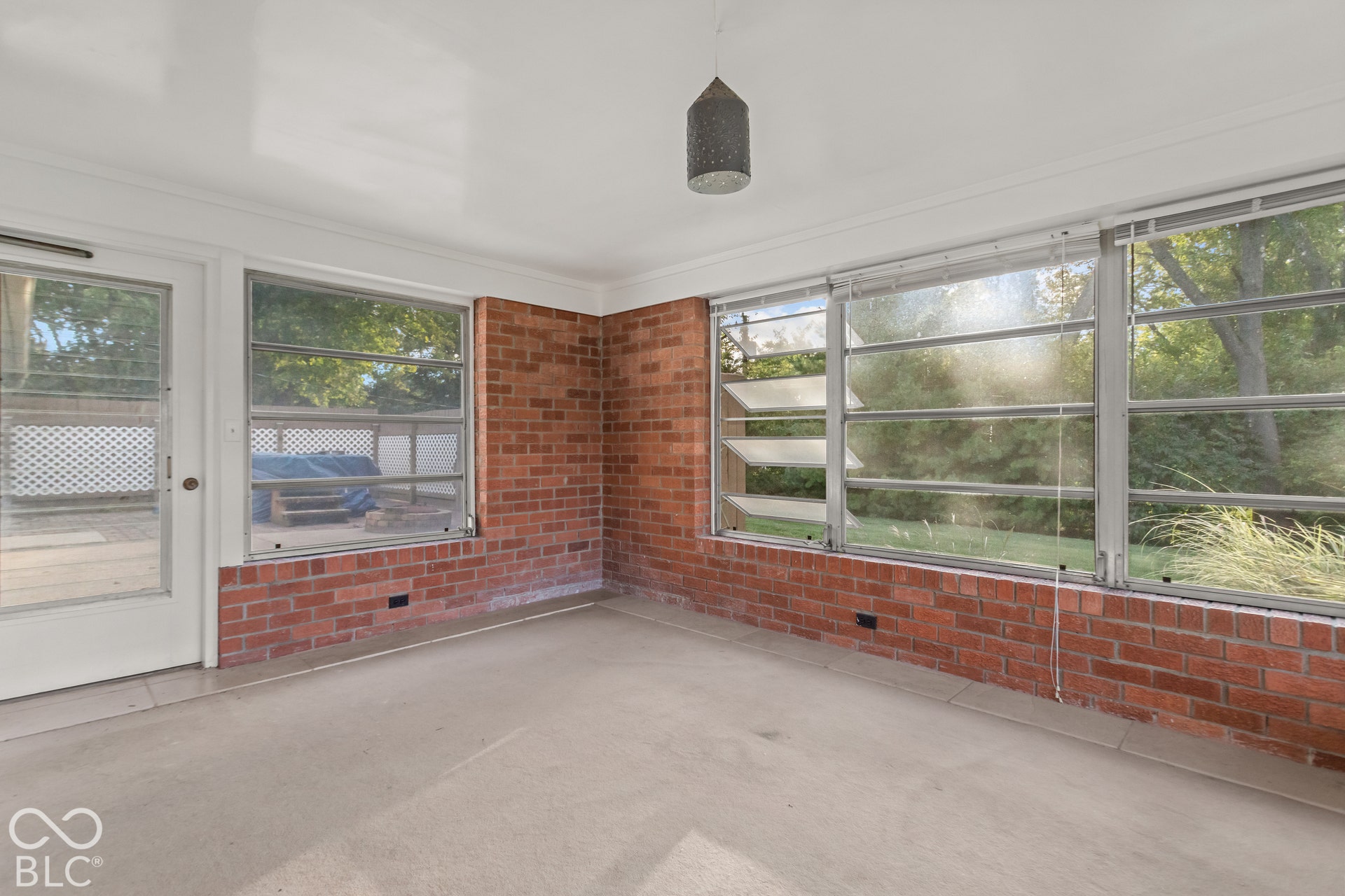 Brick wall accents and jalousie windows