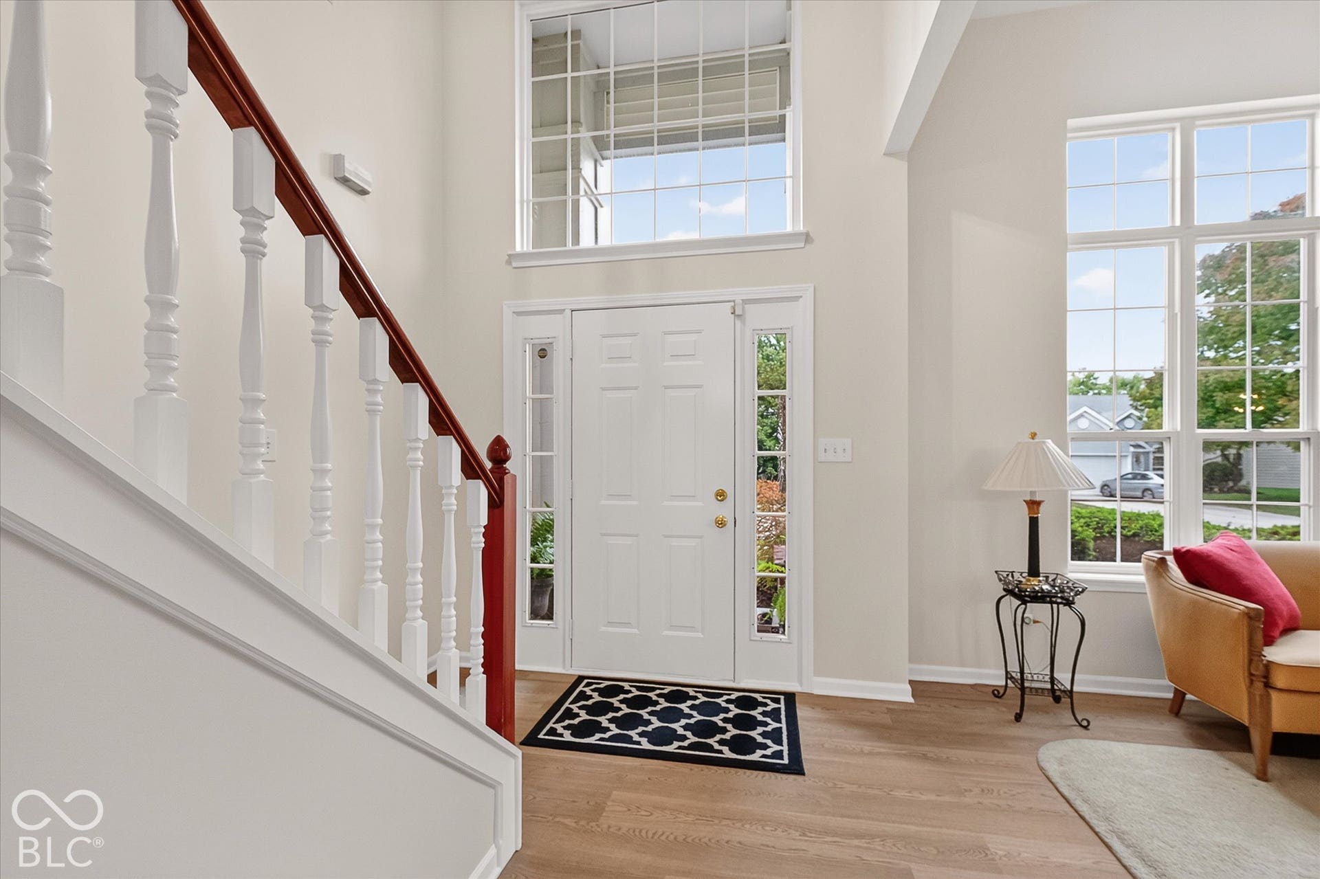 Bright 2 story entry with stunning transom window.