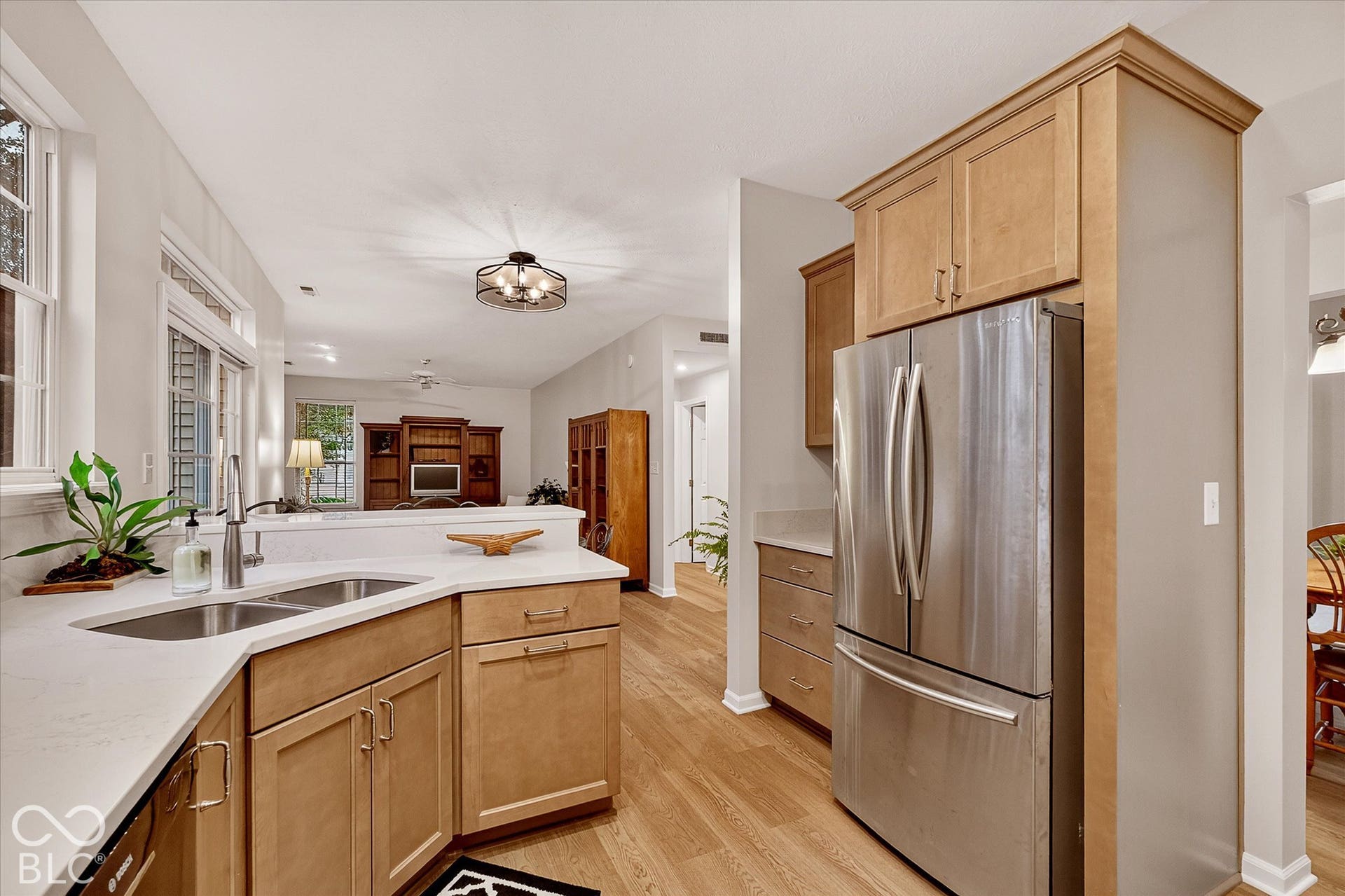 Corner double sink and quartz countertops.