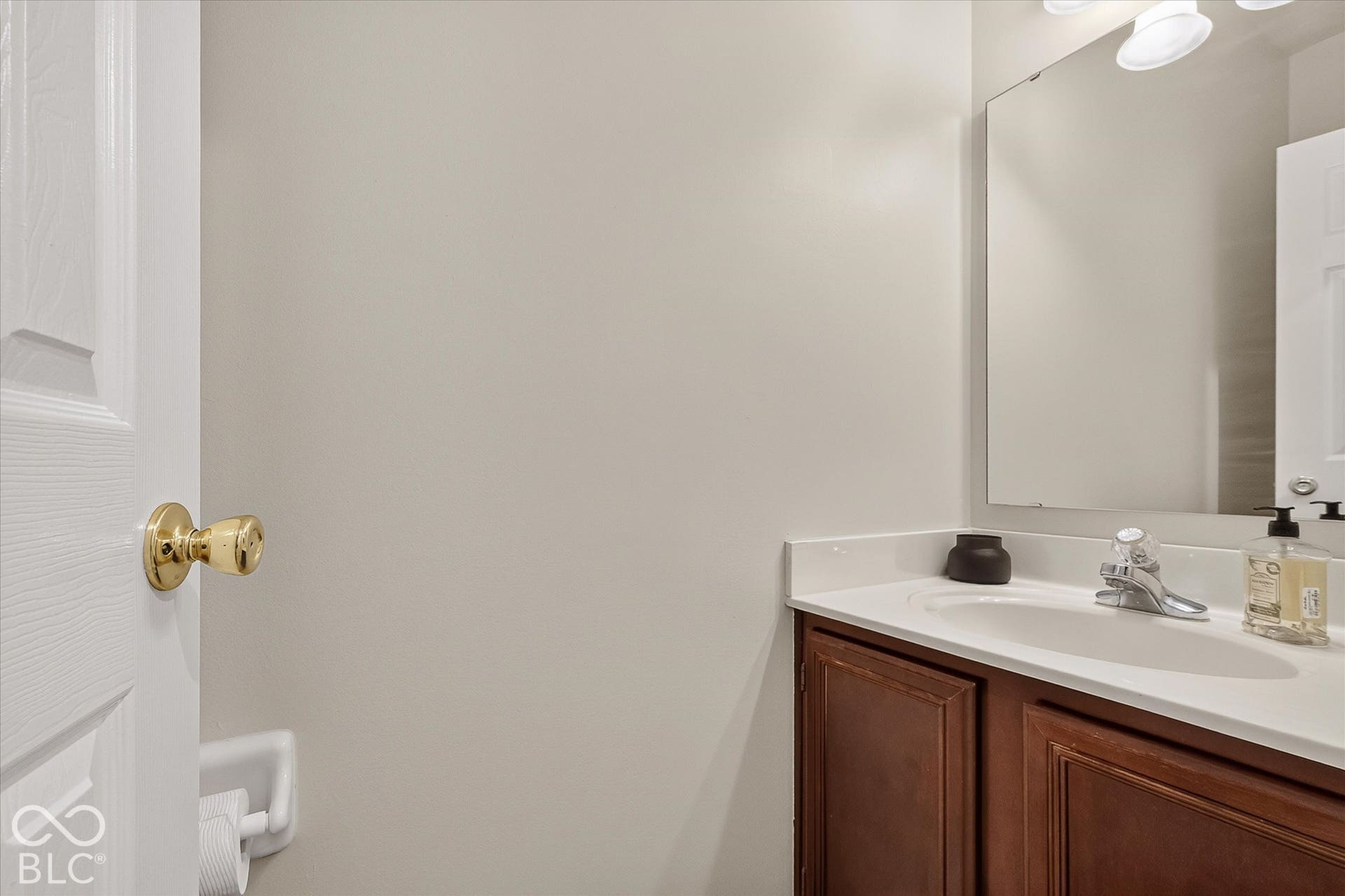Main floor half bath with fresh paint and new floor.