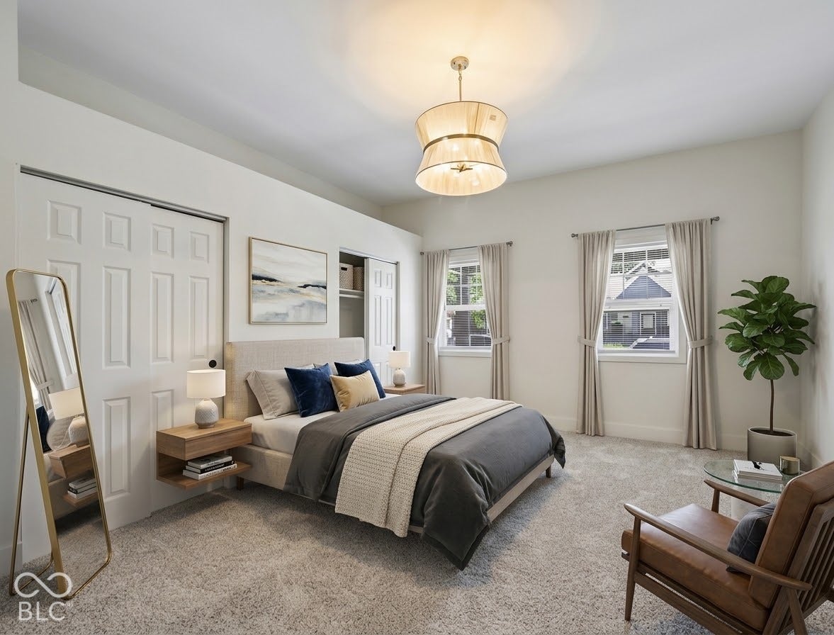 Recessed lighting, contemporary drum pendant light fixture, dual windows with neutral drapes, textured carpeting, and built-in closet storage