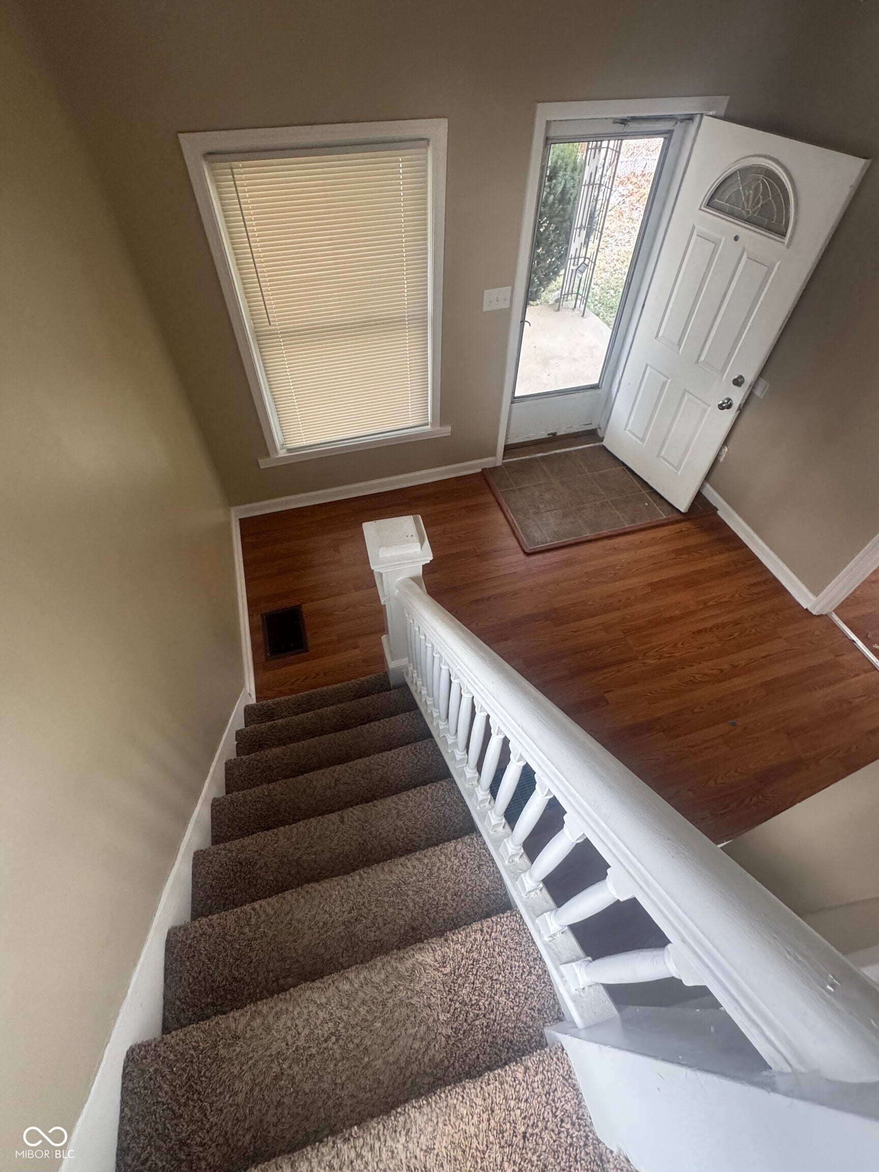 Virtually Altered - Wood-finish flooring at entry