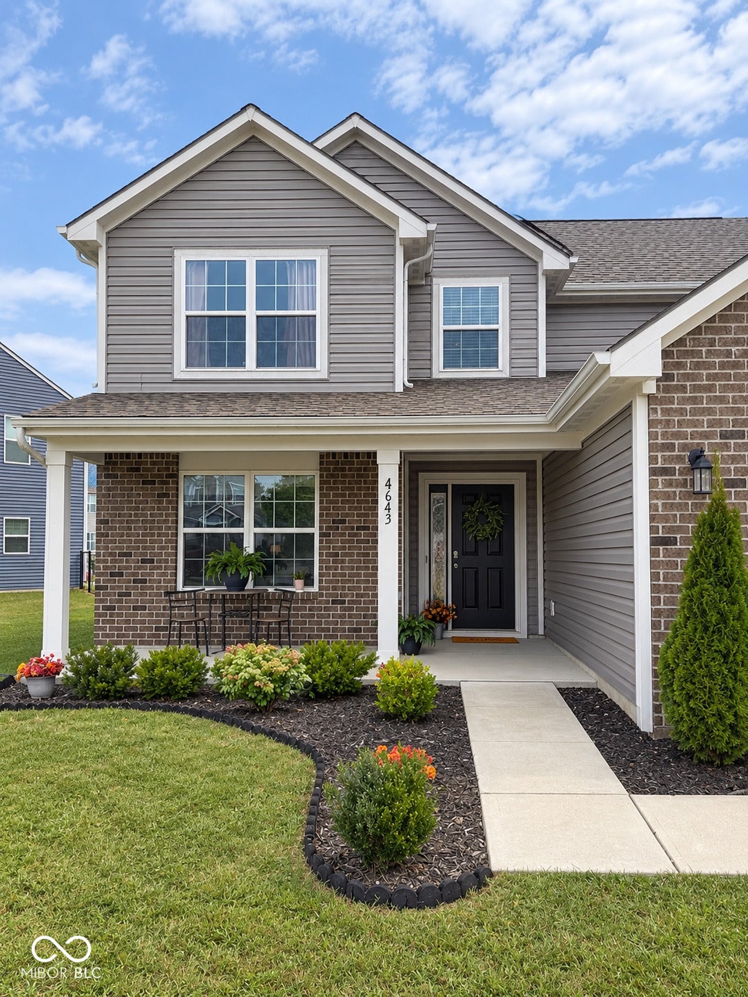 4643 Darla Court, Indianapolis, IN 46239 Exterior featuring gray horizontal siding and brick accents