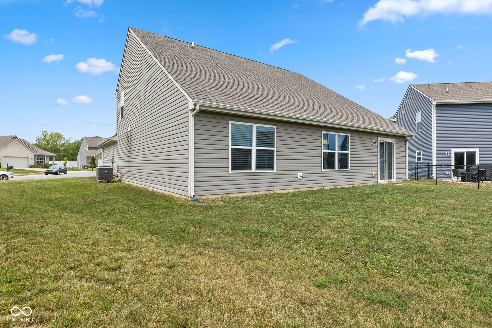 4643 Darla Court, Indianapolis, IN 46239 Expansive grassy yard with siding exterior and multiple windows