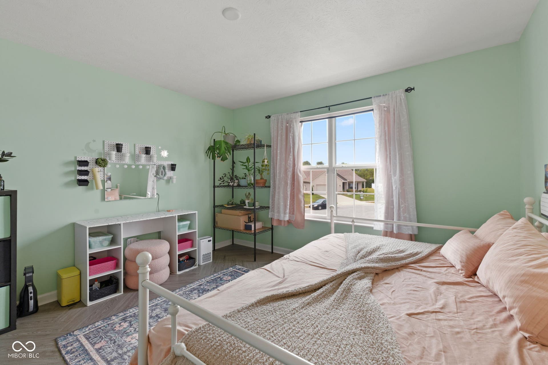 4643 Darla Court, Indianapolis, IN 46239 Window with exterior visibility, light green wall finishes, vinyl flooring, recessed ceiling light fixture, white trim