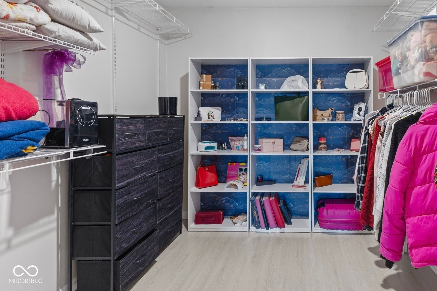 4643 Darla Court, Indianapolis, IN 46239 Built-in open shelving, wire shelving systems, wood-finish flooring, and a wall-mounted clothing rod