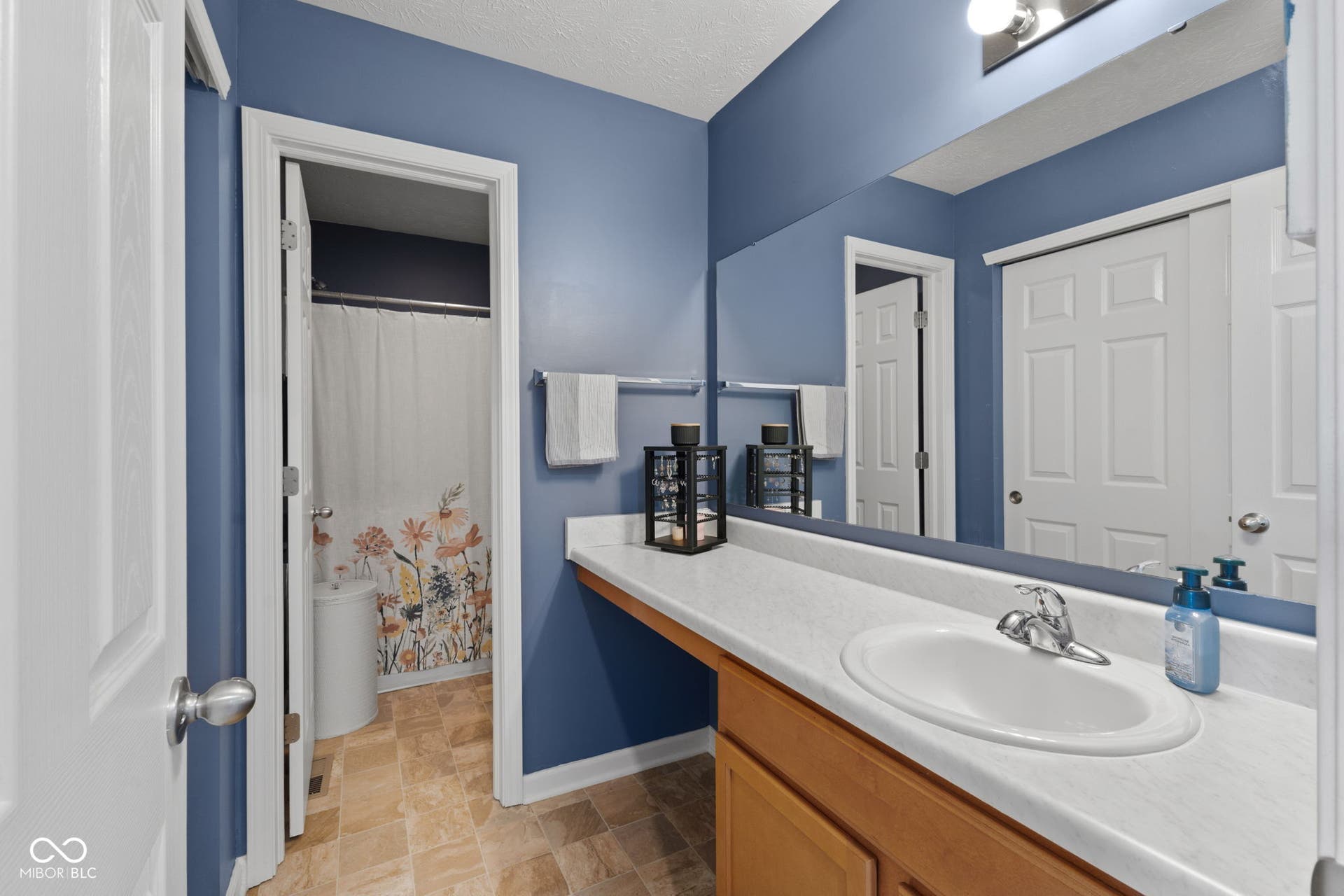 4643 Darla Court, Indianapolis, IN 46239 Built-in vanity with a single basin sink and chrome faucet