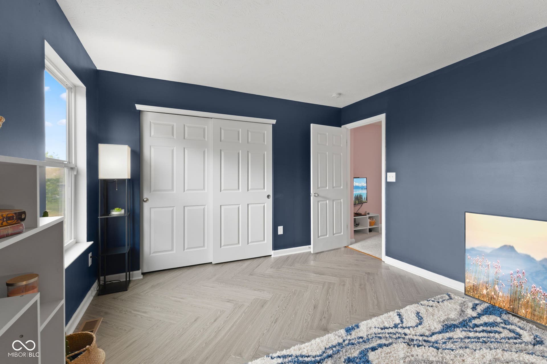 4643 Darla Court, Indianapolis, IN 46239 Herringbone vinyl flooring, white trim, and a white six-panel door