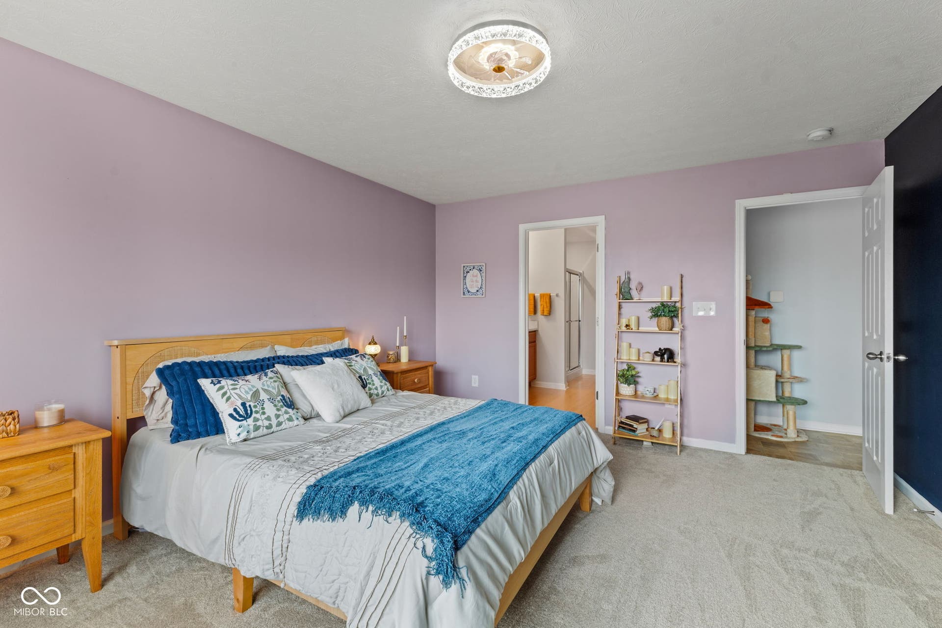 4643 Darla Court, Indianapolis, IN 46239 Carpeted room with a ceiling-mounted light fixture, light purple walls, and a wood-finish bed frame