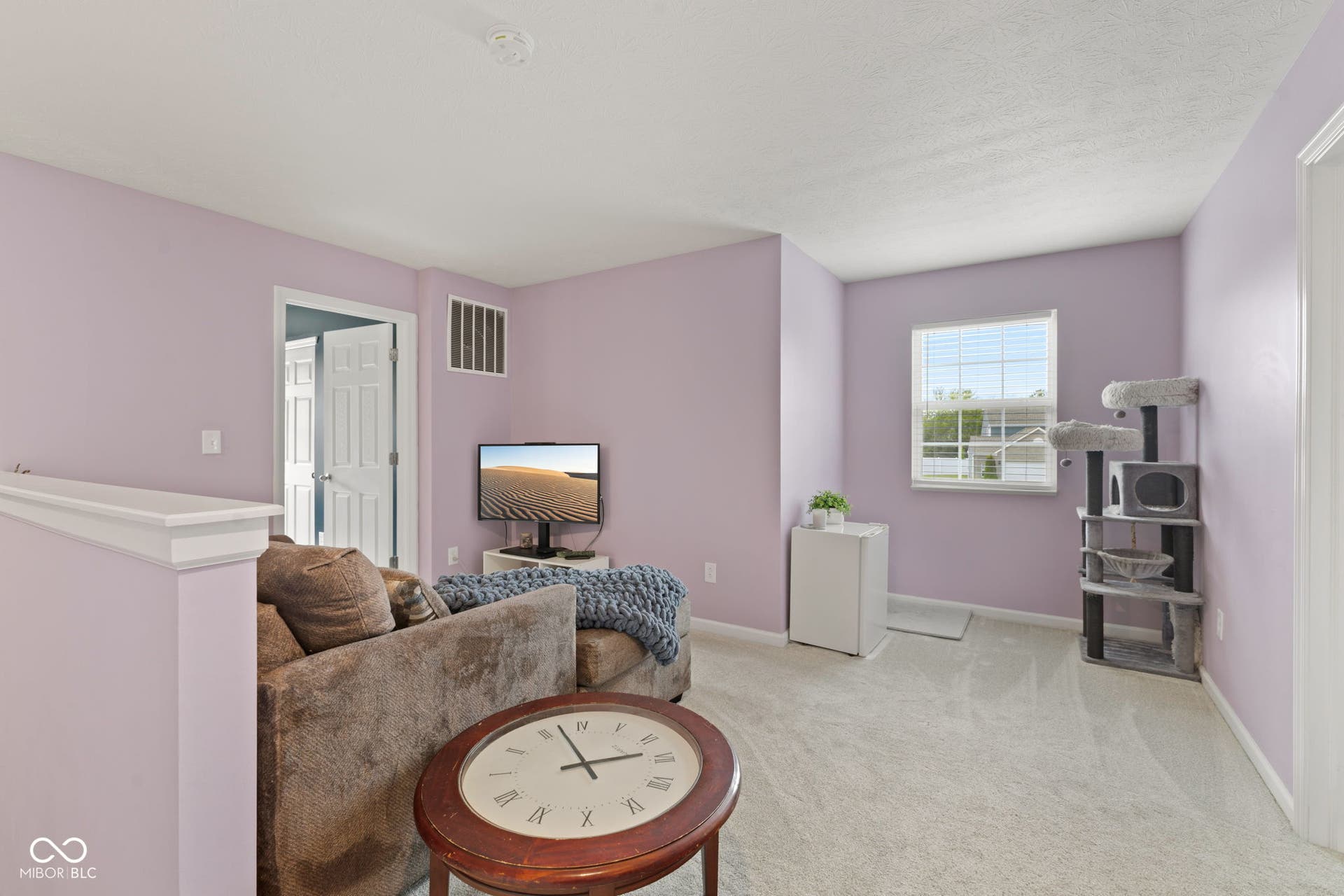 4643 Darla Court, Indianapolis, IN 46239 Carpeted room with a single window, white trim, and a white interior door