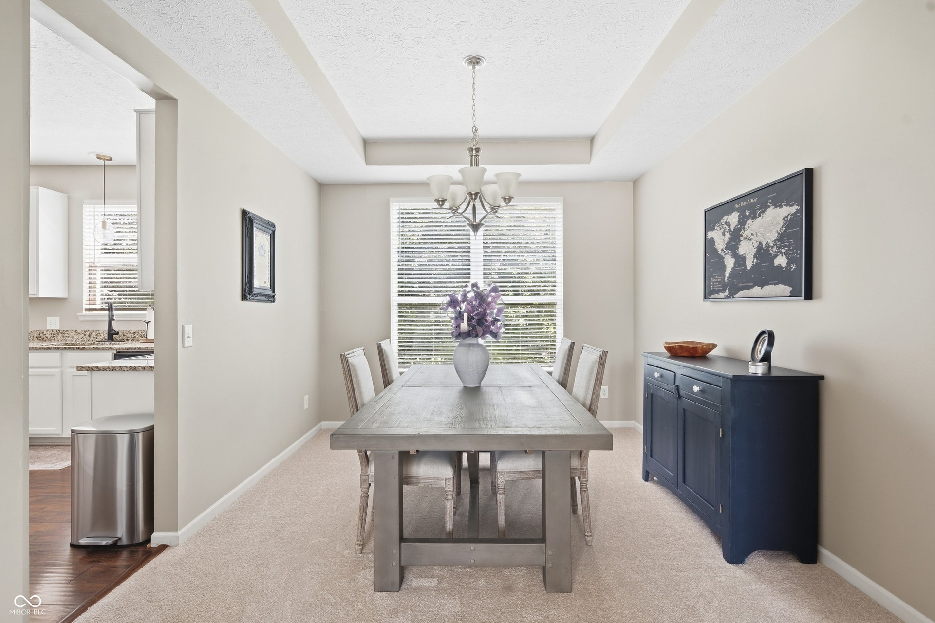 Recessed ceiling detail with a central chandelier