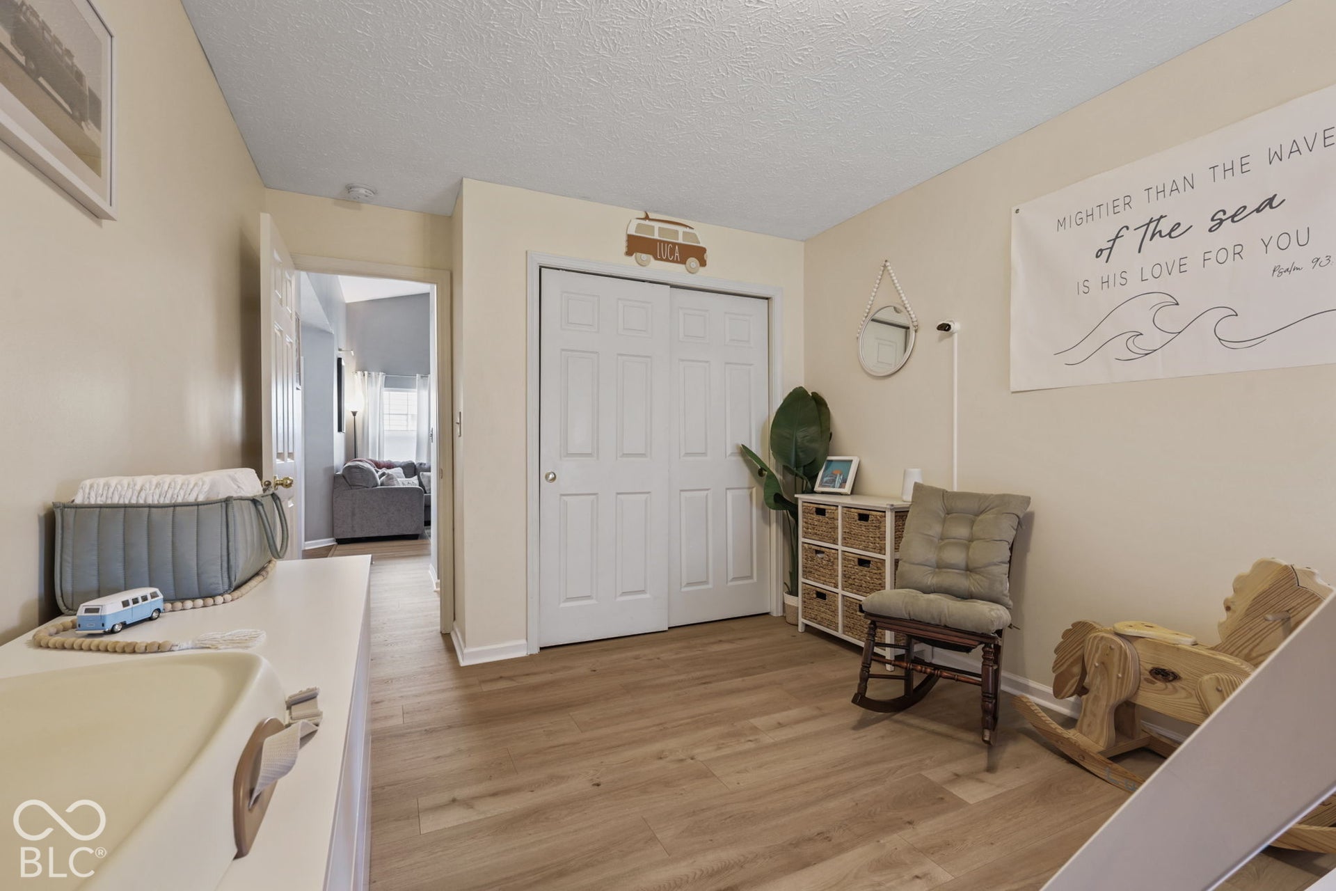 Interior space featuring wood-finish flooring and double-panel closet doors
