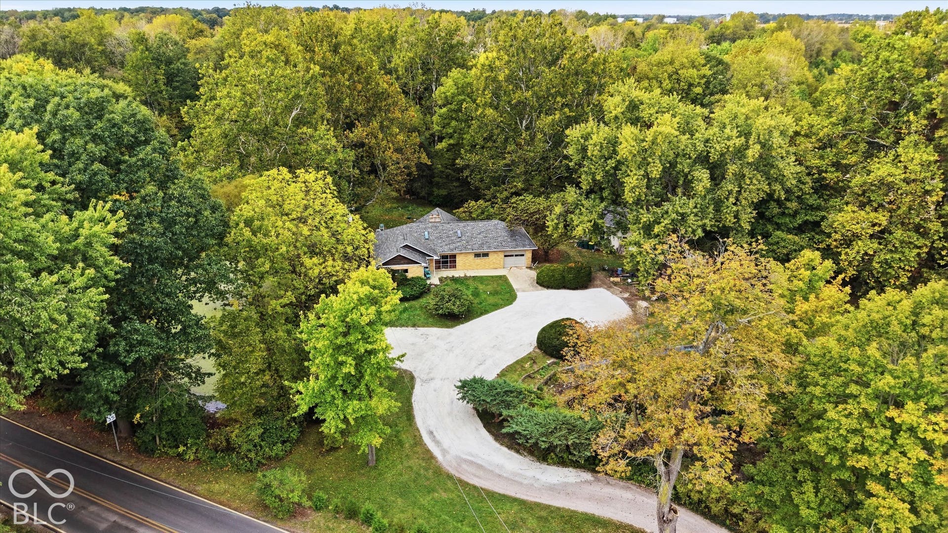 Single-story residence featuring a shingled roof and an attached garage