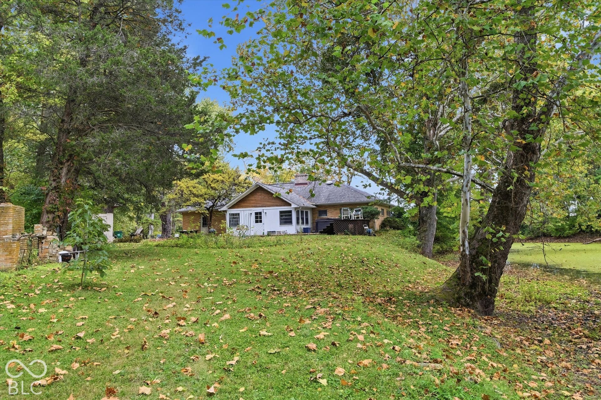 Expansive lawn with mature trees, offering a verdant setting