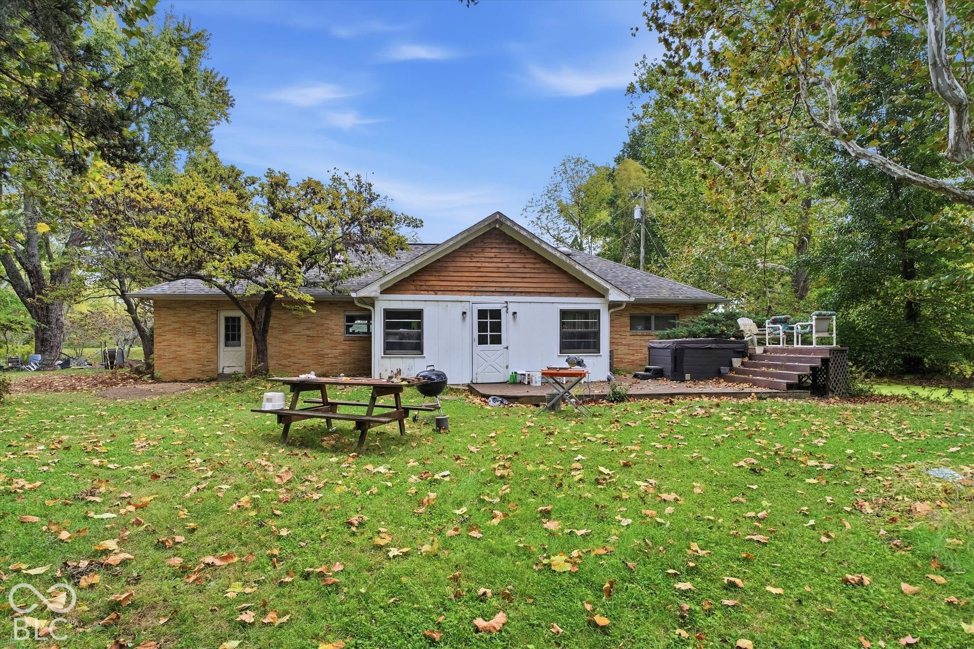 Expansive green lawn with mature trees