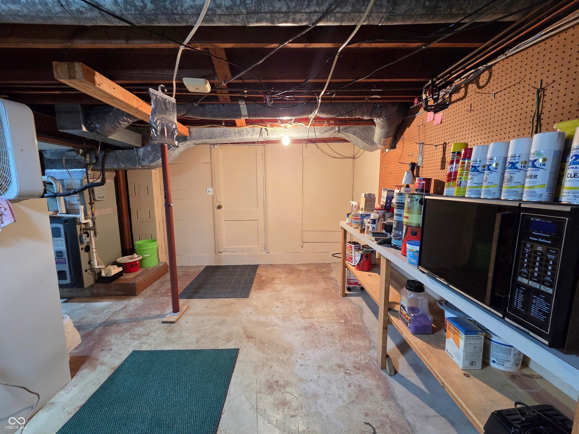 Lots of storage and workshop area in basement