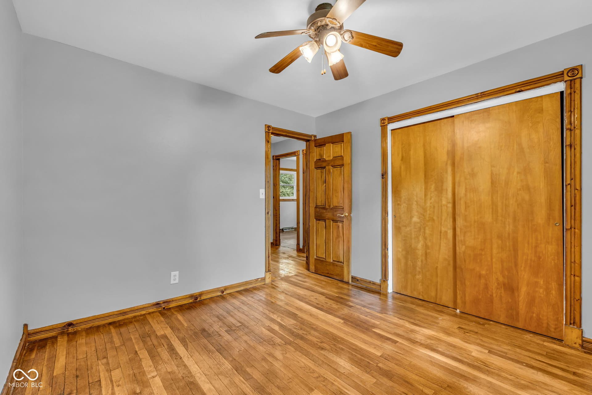 Wood-finish flooring with coordinating wood trim and doors