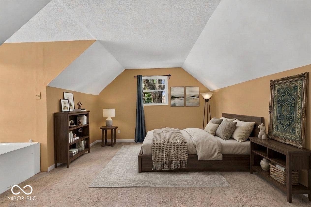 Carpeted flooring, vaulted ceiling, and window with exterior view