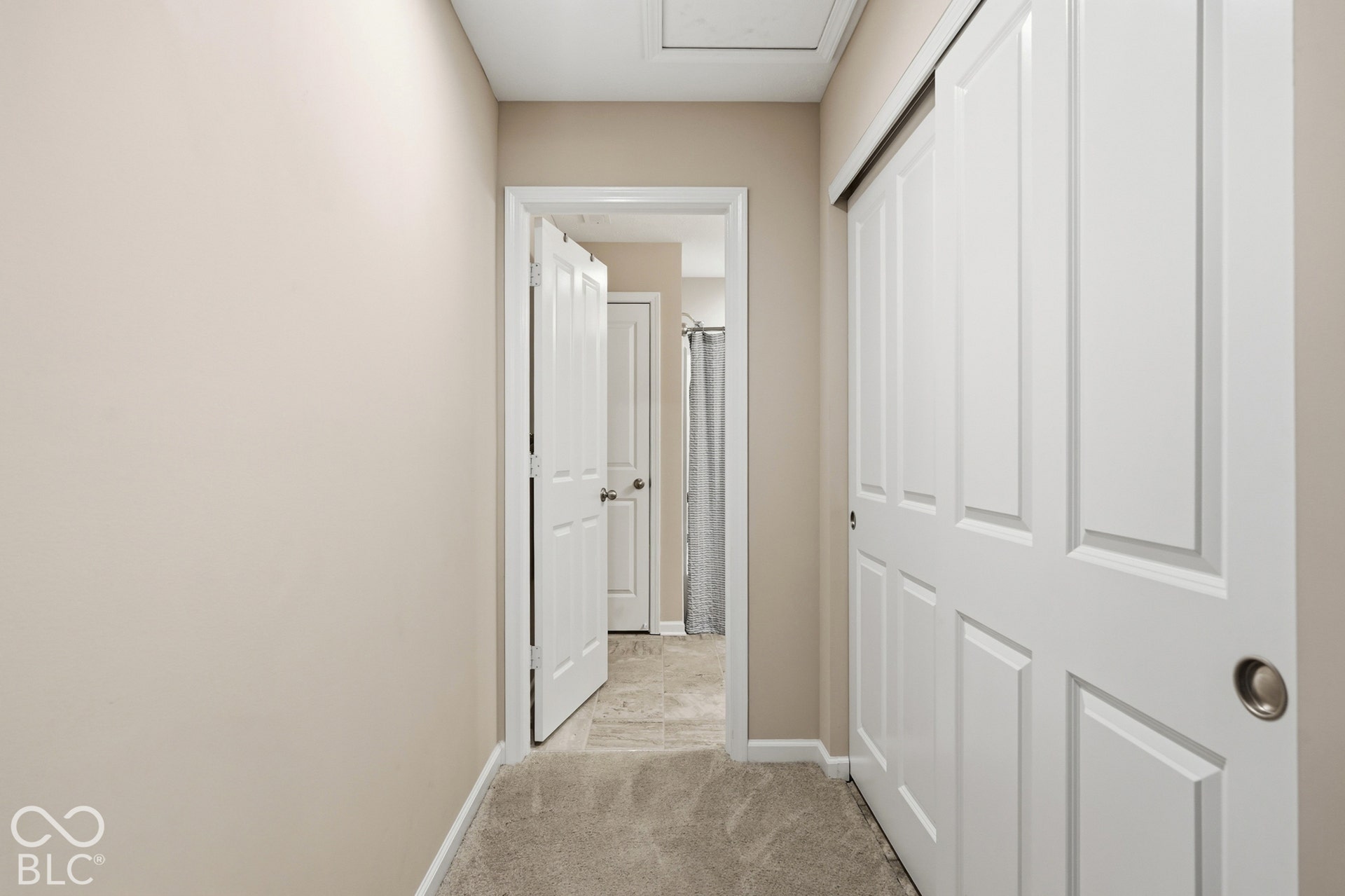 Upstairs hallway leading to full bathroom