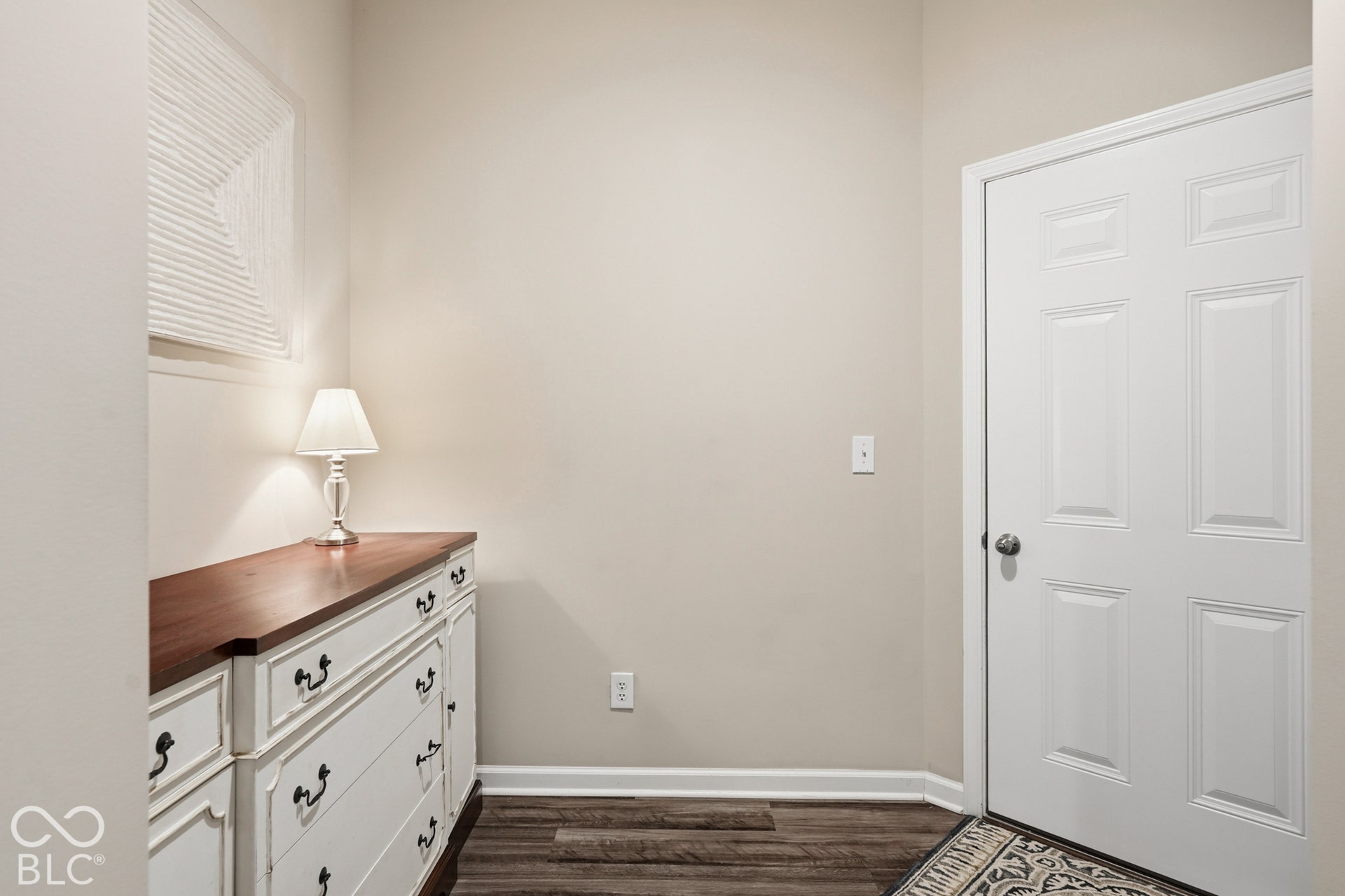 Back hallway coming in from garage has spacious nook for a large piece of furnture