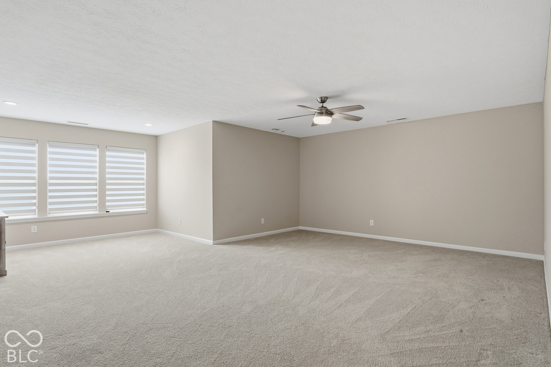 Large versatile Bonus Room could be used as a 3rd bedroom; has window and walk in closet plus 3rd full bath on same level.