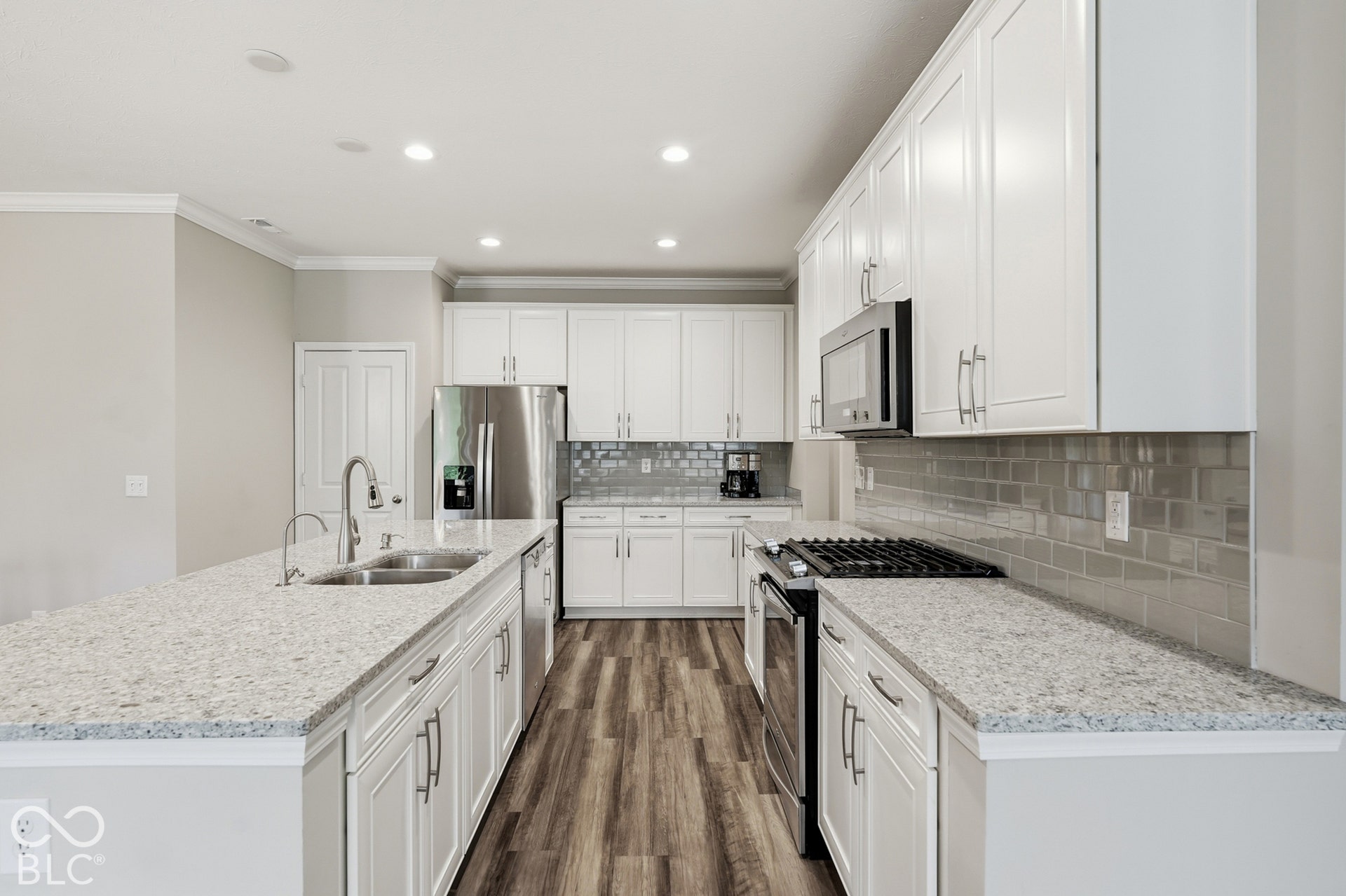 Bright white kitchen with white quartz countertops