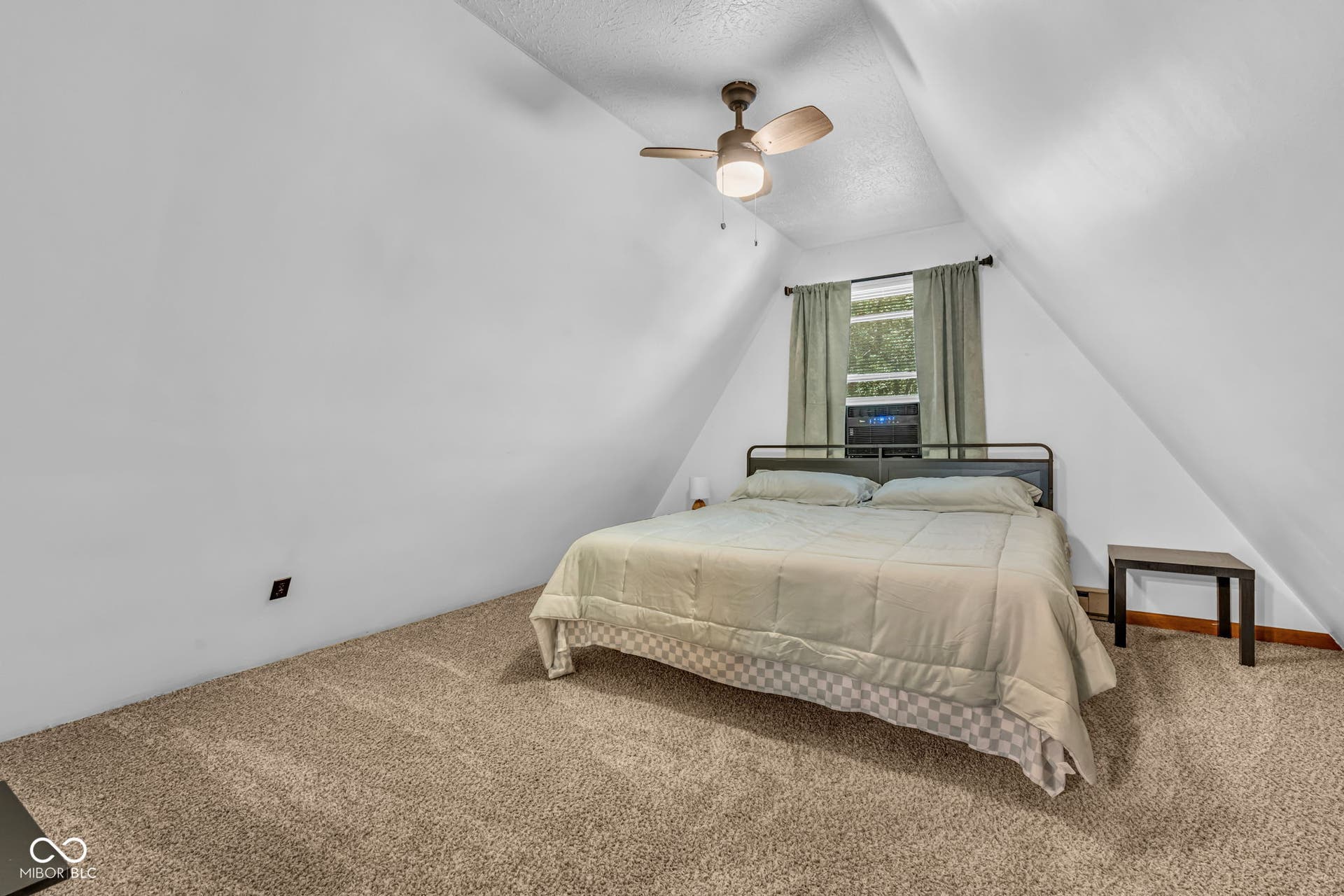 5432 W Whittier Drive, Knightstown, IN 46148 Sloped ceiling room featuring a window with natural light, overhead ceiling fan, and neutral carpet flooring