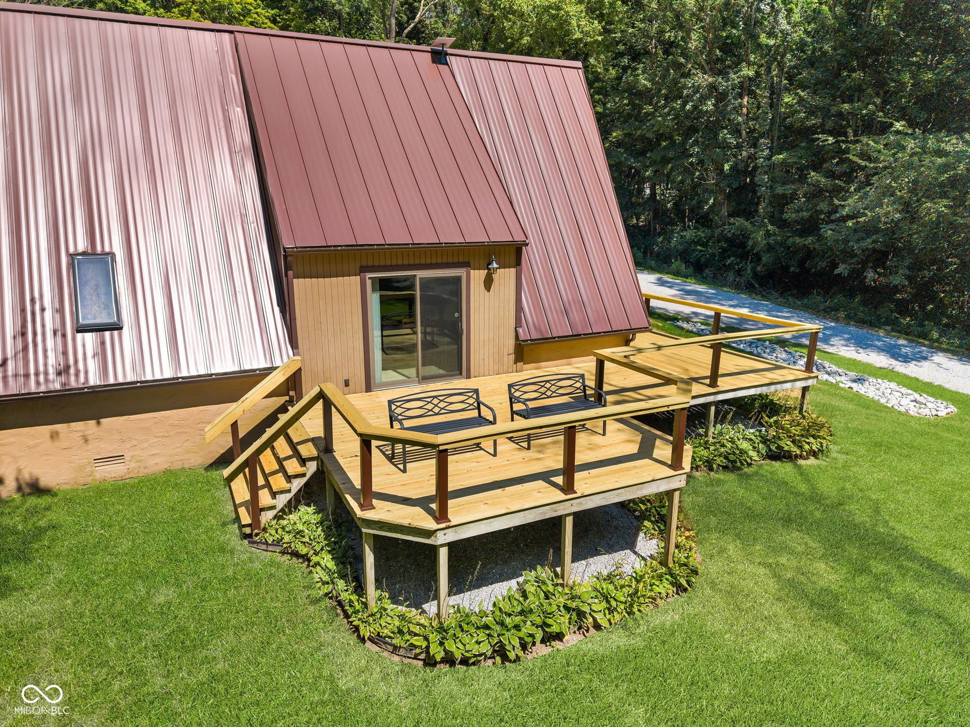 5432 W Whittier Drive, Knightstown, IN 46148 A-frame residence featuring a metal roof, exterior siding, and a sliding glass door