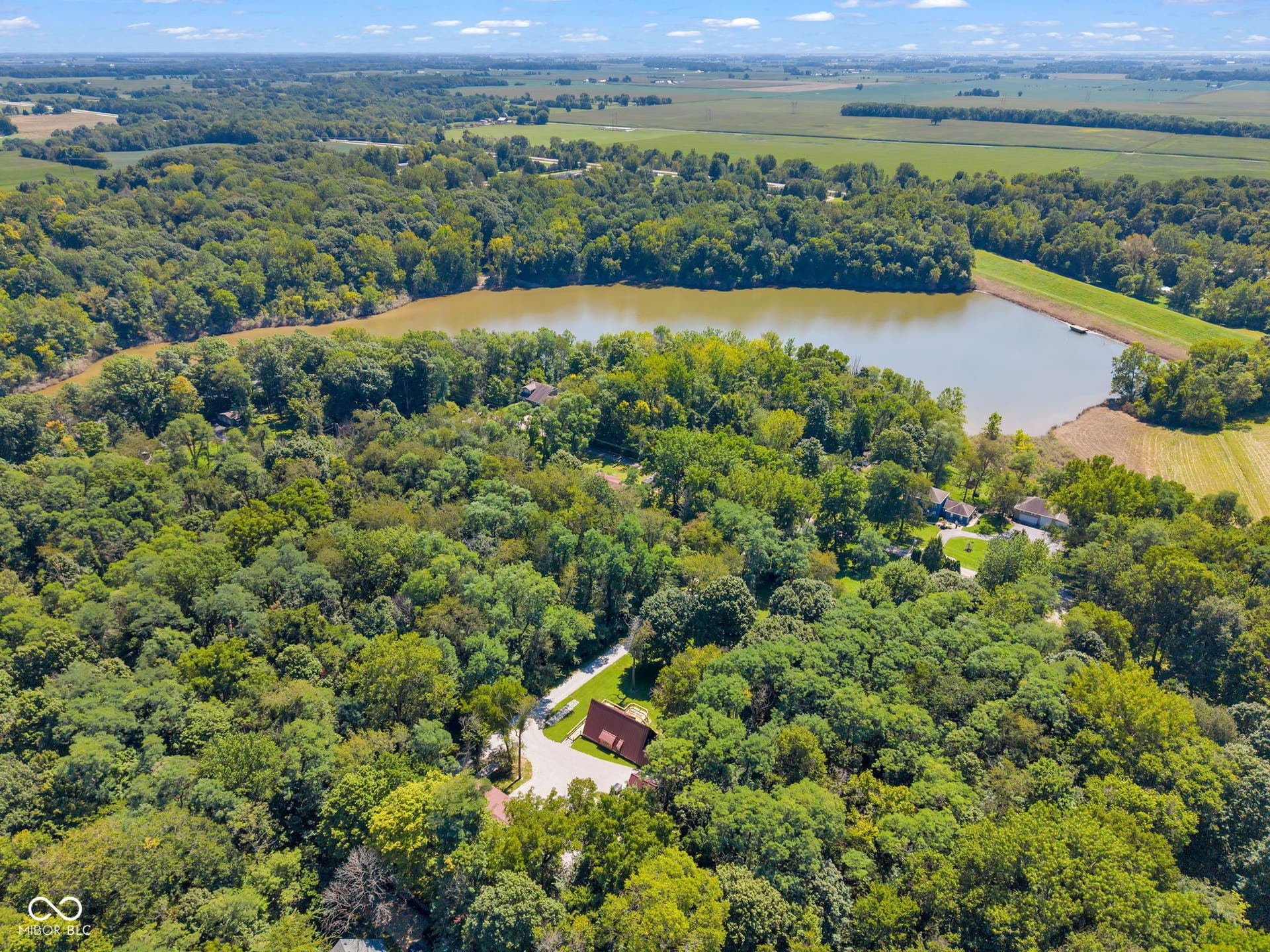 5432 W Whittier Drive, Knightstown, IN 46148 Wooded setting with a prominent lake and surrounding agricultural fields
