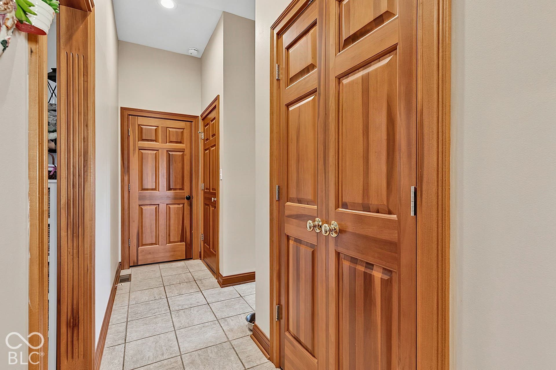 Tiled flooring, wood-finish doors, and recessed lighting