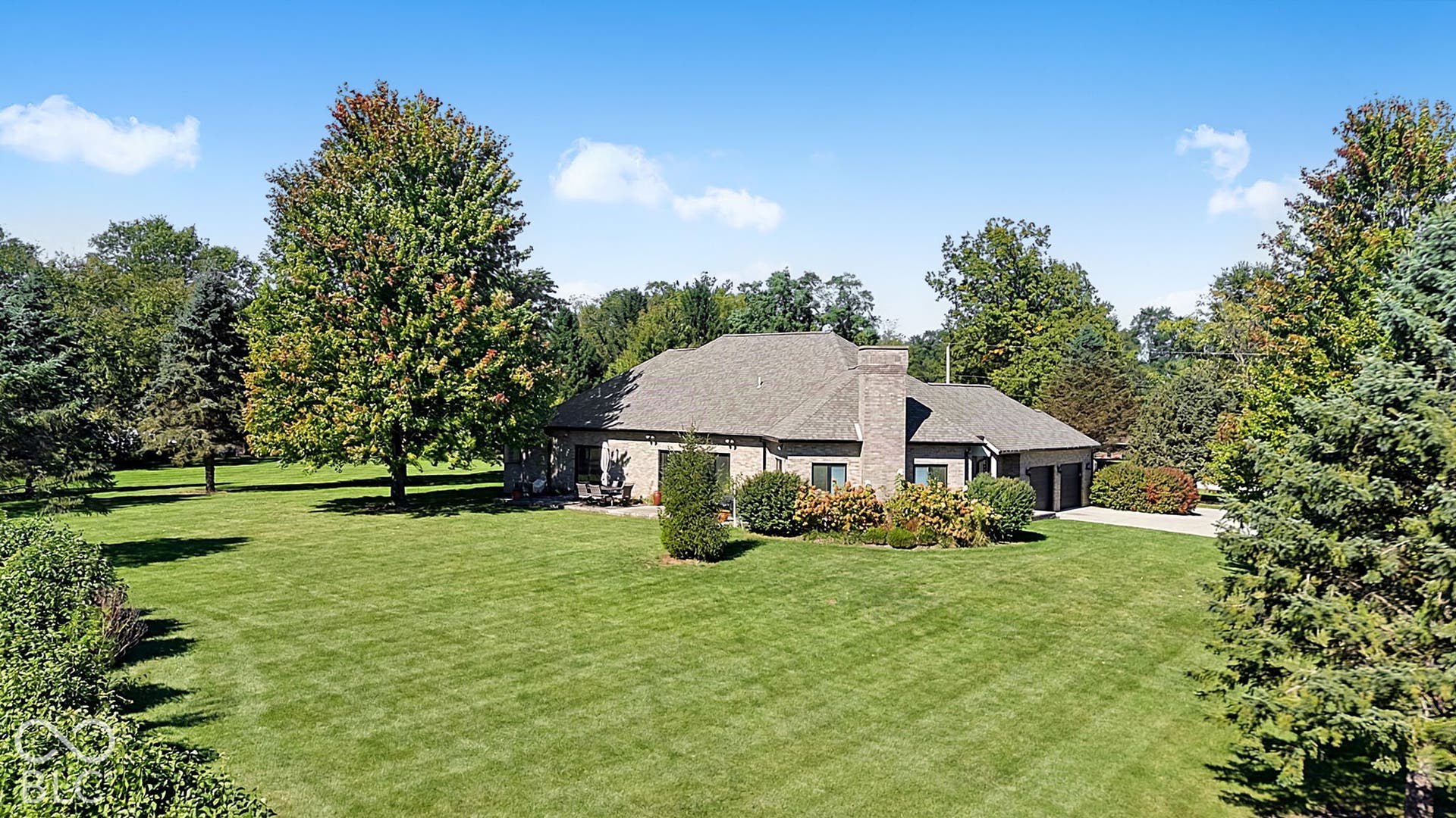 Brick exterior with a gabled roof and attached two-car garage