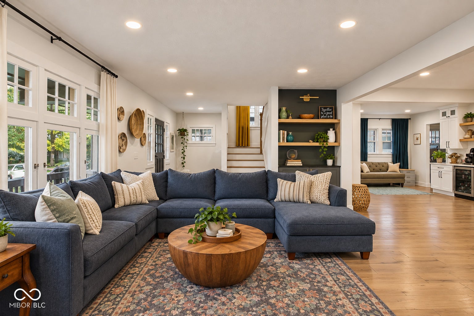 Virtually Altered - Recessed lighting, wood-finish flooring, built-in shelving, white cabinetry, and a beverage refrigerator