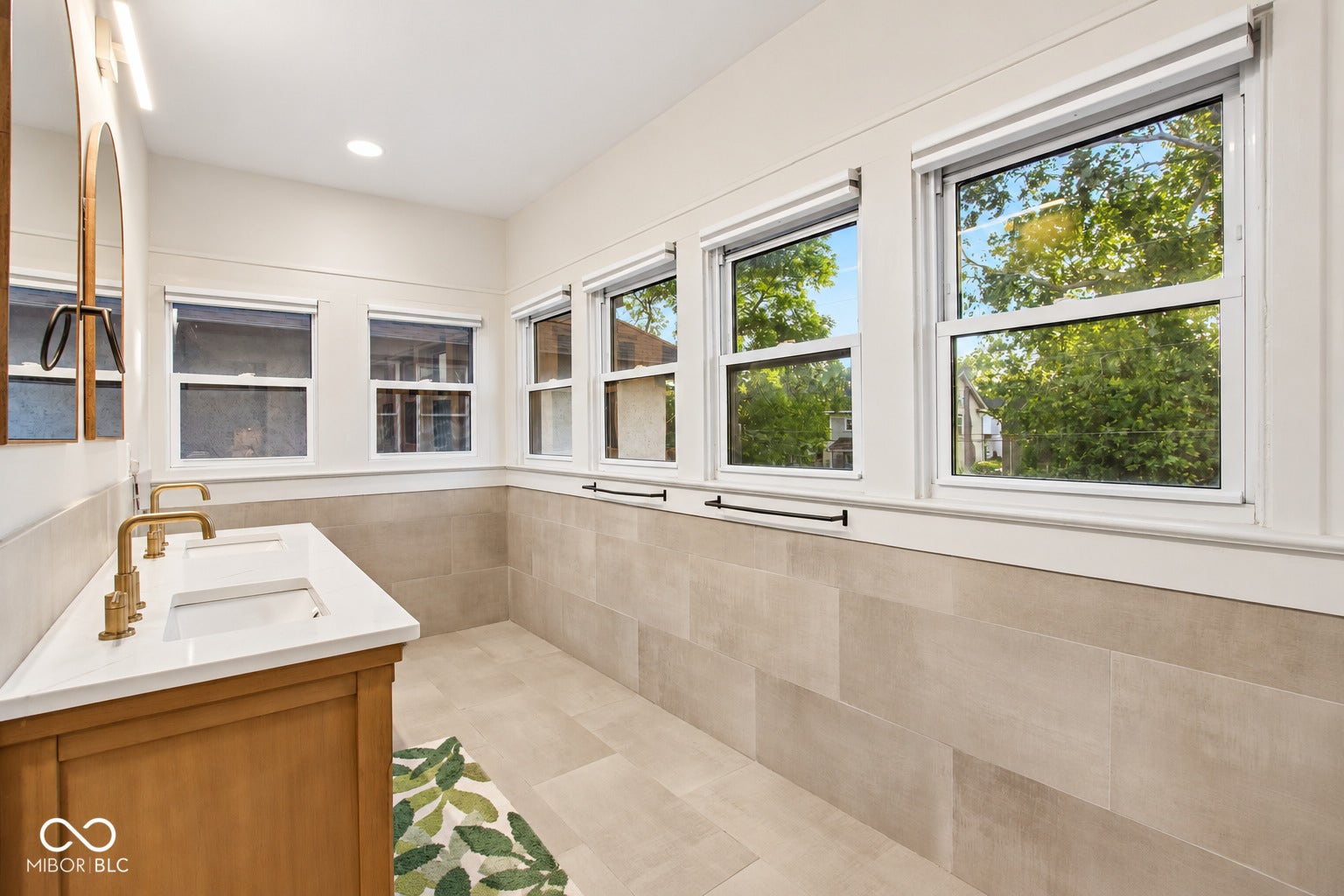 Double vanity with dual rectangular sinks and gold-tone fixtures