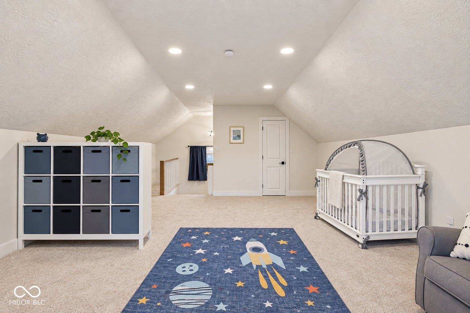 Bedroom 4: also could be used as a loft, with vaulted ceiling with recessed lighting, light-toned carpeting, and a window with white trim