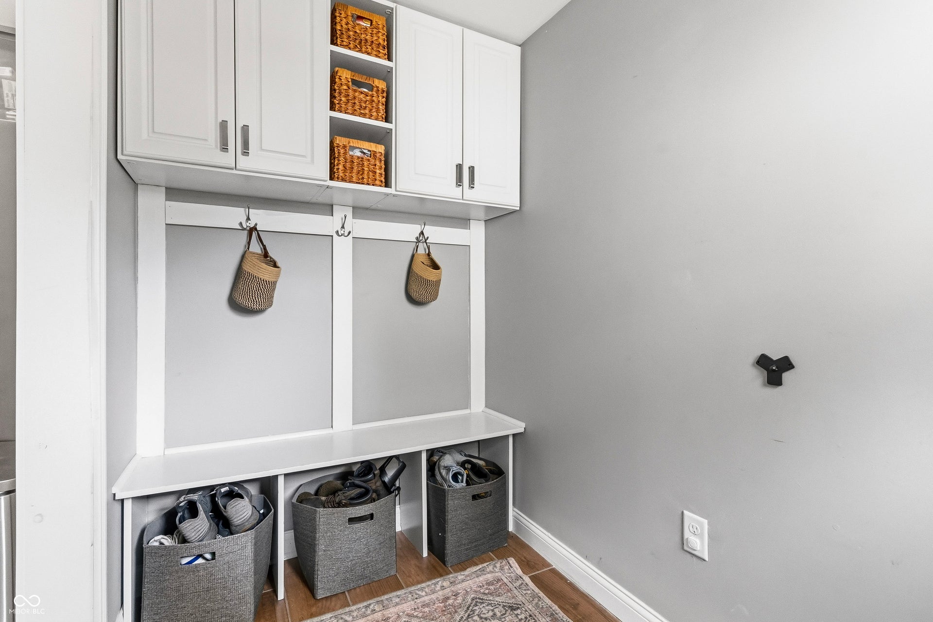 Mud room area off of side-door entryway