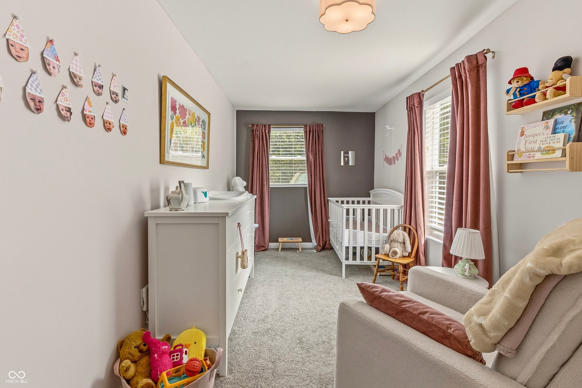 Wall-to-wall carpeting, two windows with blinds and curtain rods, built-in wall shelving, large closet
