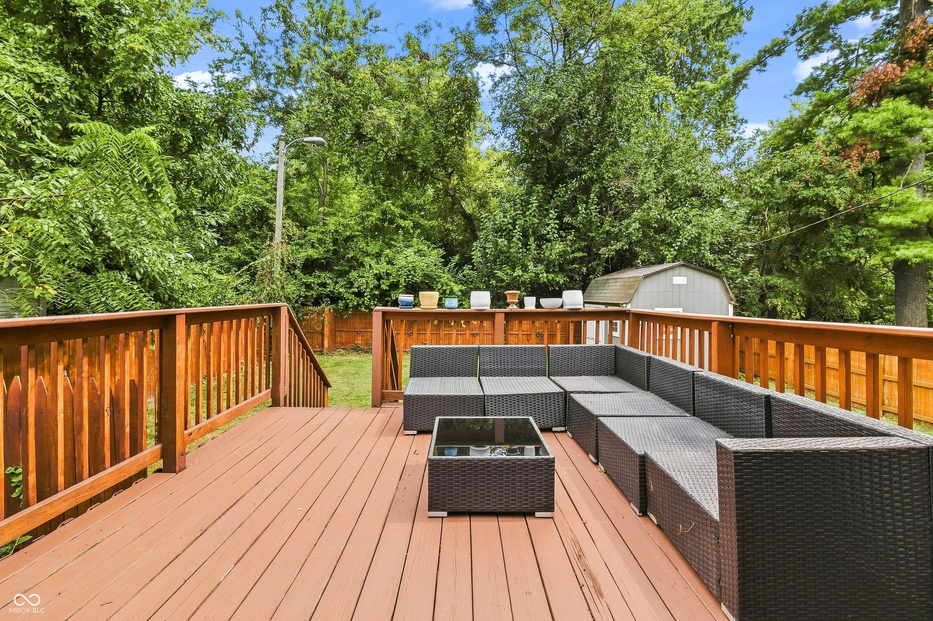 Mature-tree backdrop provides privacy in back yard area