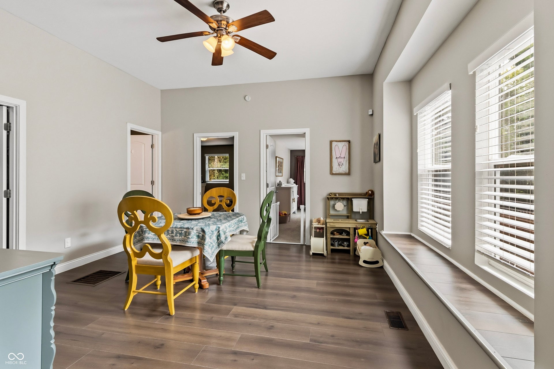 Formal dining area or extra living space featuring recessed lighting, LVP flooring, vaulted ceilings, and natural light