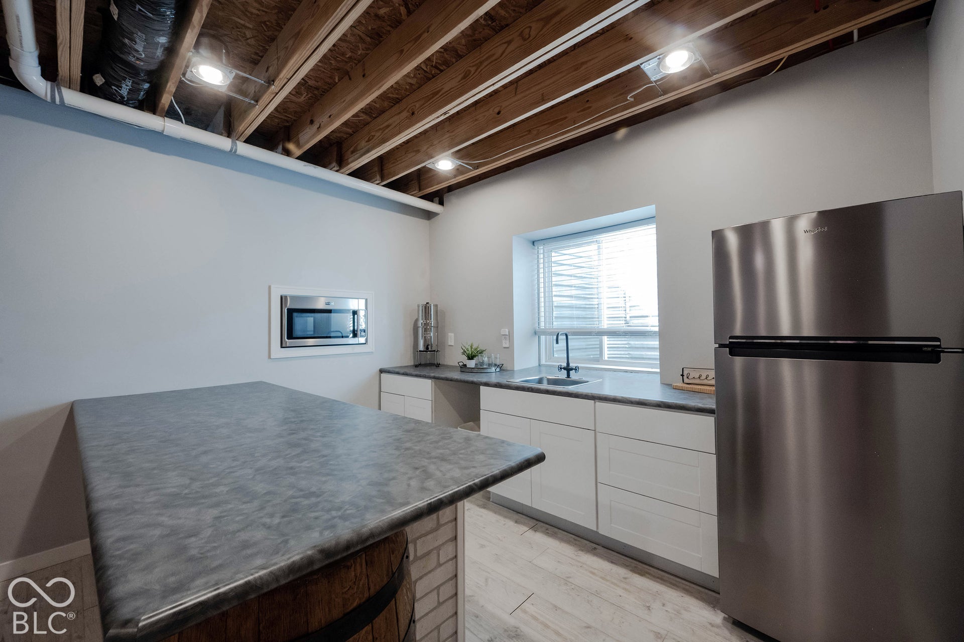 11614 Platt Street, Noblesville, IN 46060 The kitchenette is ideal for hosting, with an island bar, full refrigerator, microwave, sink, and even more natural light!